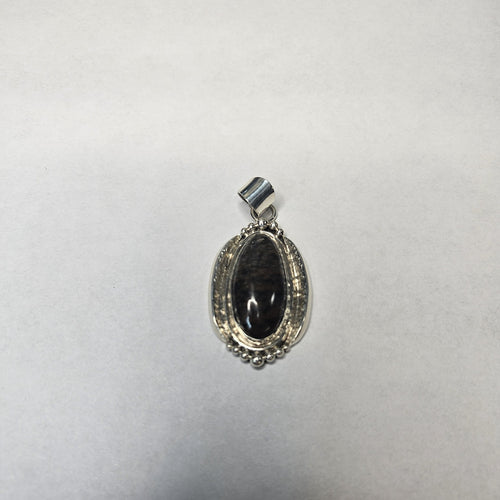 Banded onyx oval cabochon in sterling silver pendant — Navajo handcrafted by Teddy