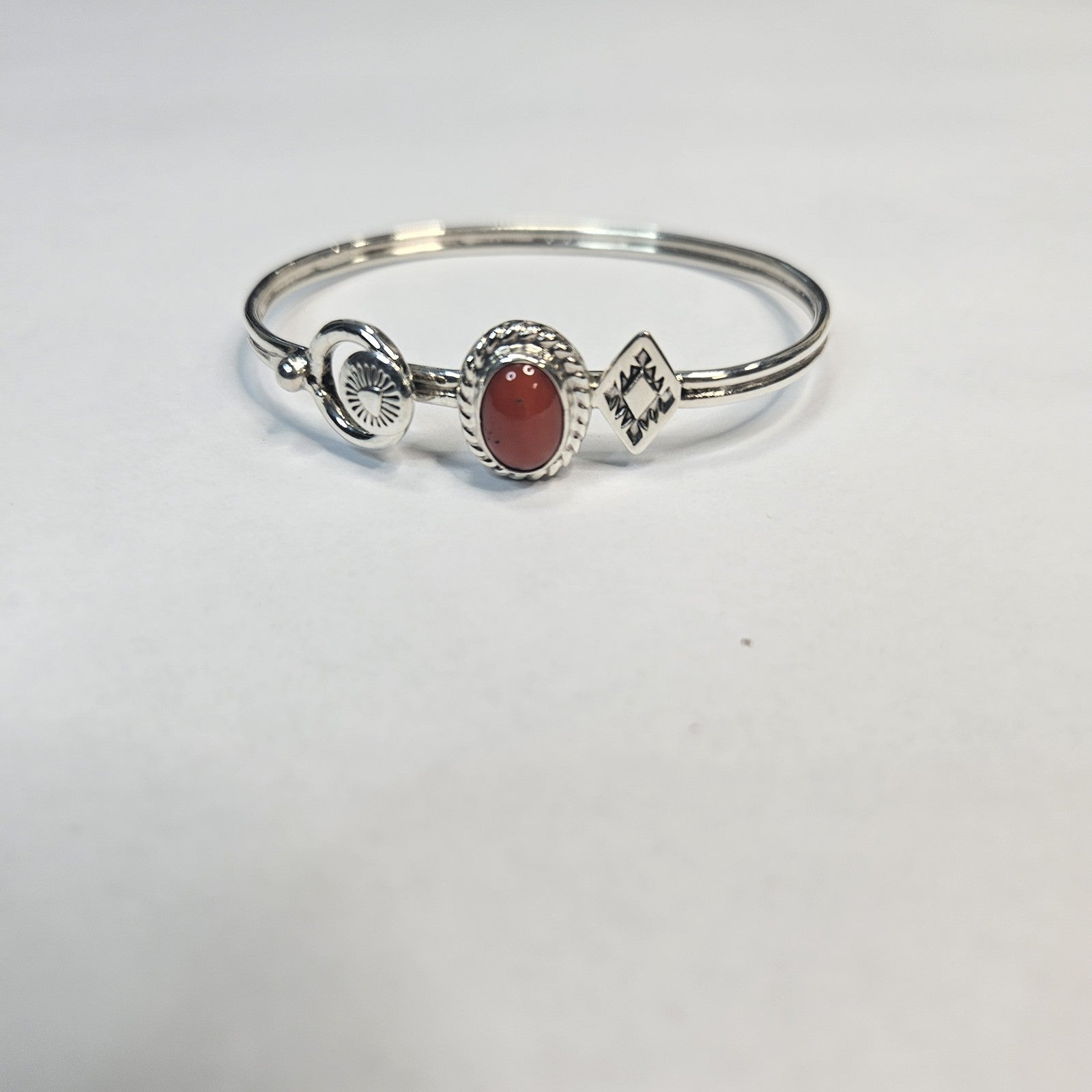 Red coral cabochon sterling silver cuff with stamped accents — Navajo handcrafted by Teddy