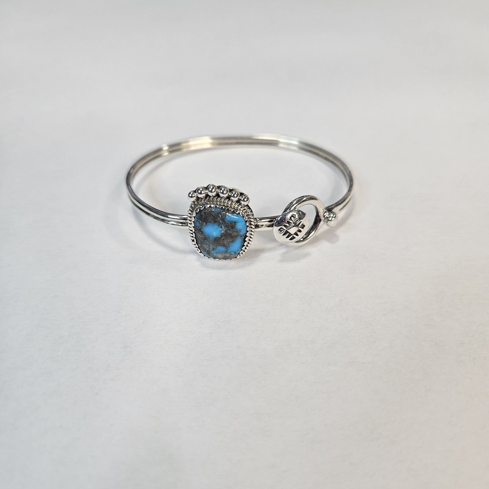 Deep blue cushion-cut turquoise sterling silver cuff — Navajo handcrafted by Teddy