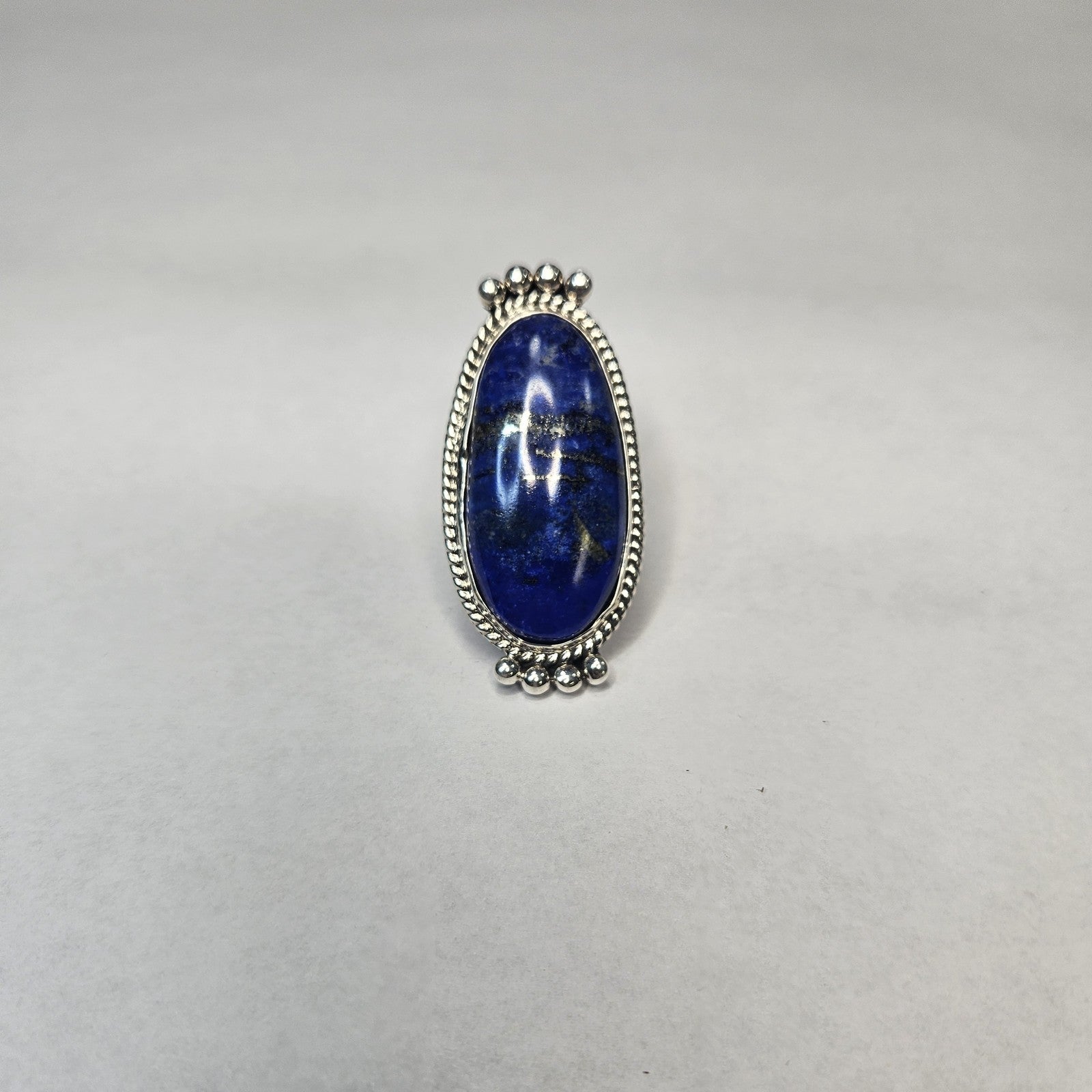 Elongated oval lapis lazuli statement ring with pyrite flecks in sterling silver — Navajo handcrafted by Teddy